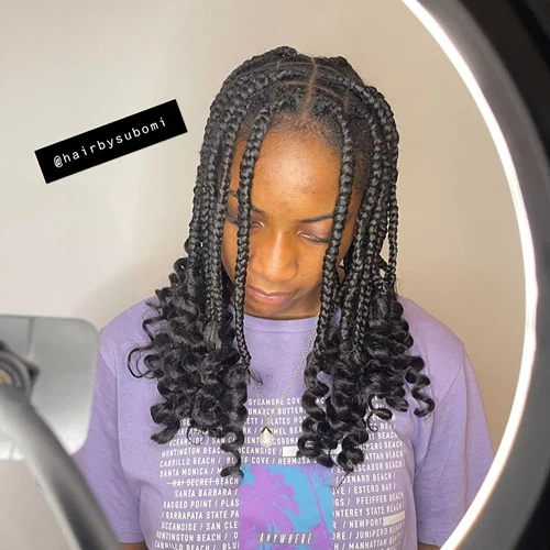 Coi Leray Braids with fluffy curled ends