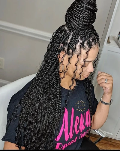 Bohemian knotless braids in a high bun