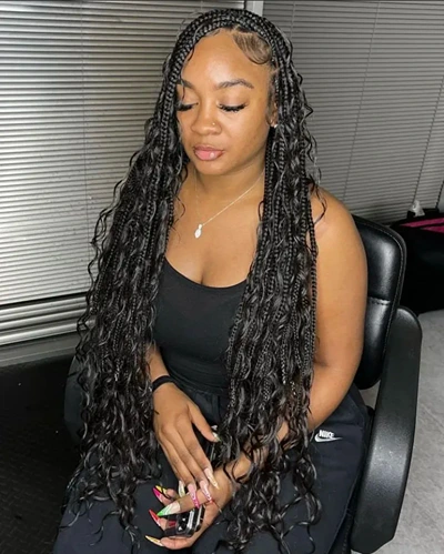 Jet black boho knotless braids with human hair curls