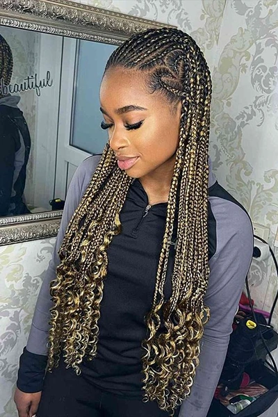 black and blonde knotless braids with curly ends