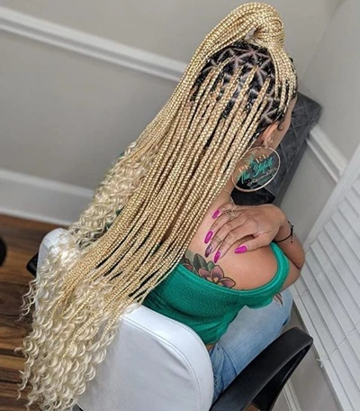 blonde knotless braids with curly ends