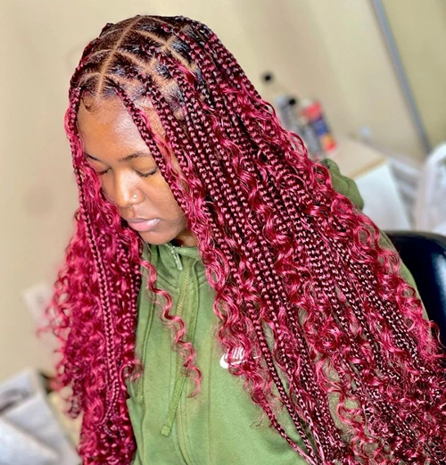 red knotless braids with curls